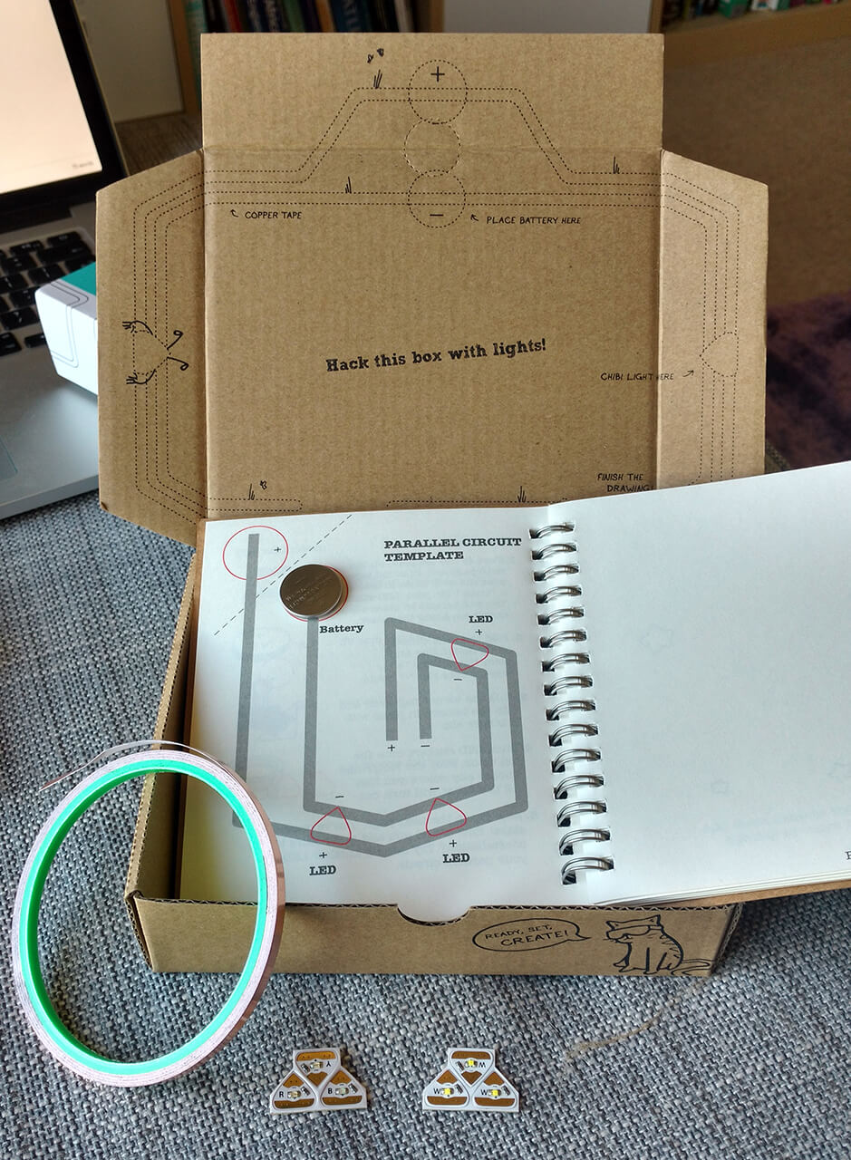 The Circuit Stickers starter kit unboxed: the sketchbook, copper tape, LED stickers and a coin cell battery