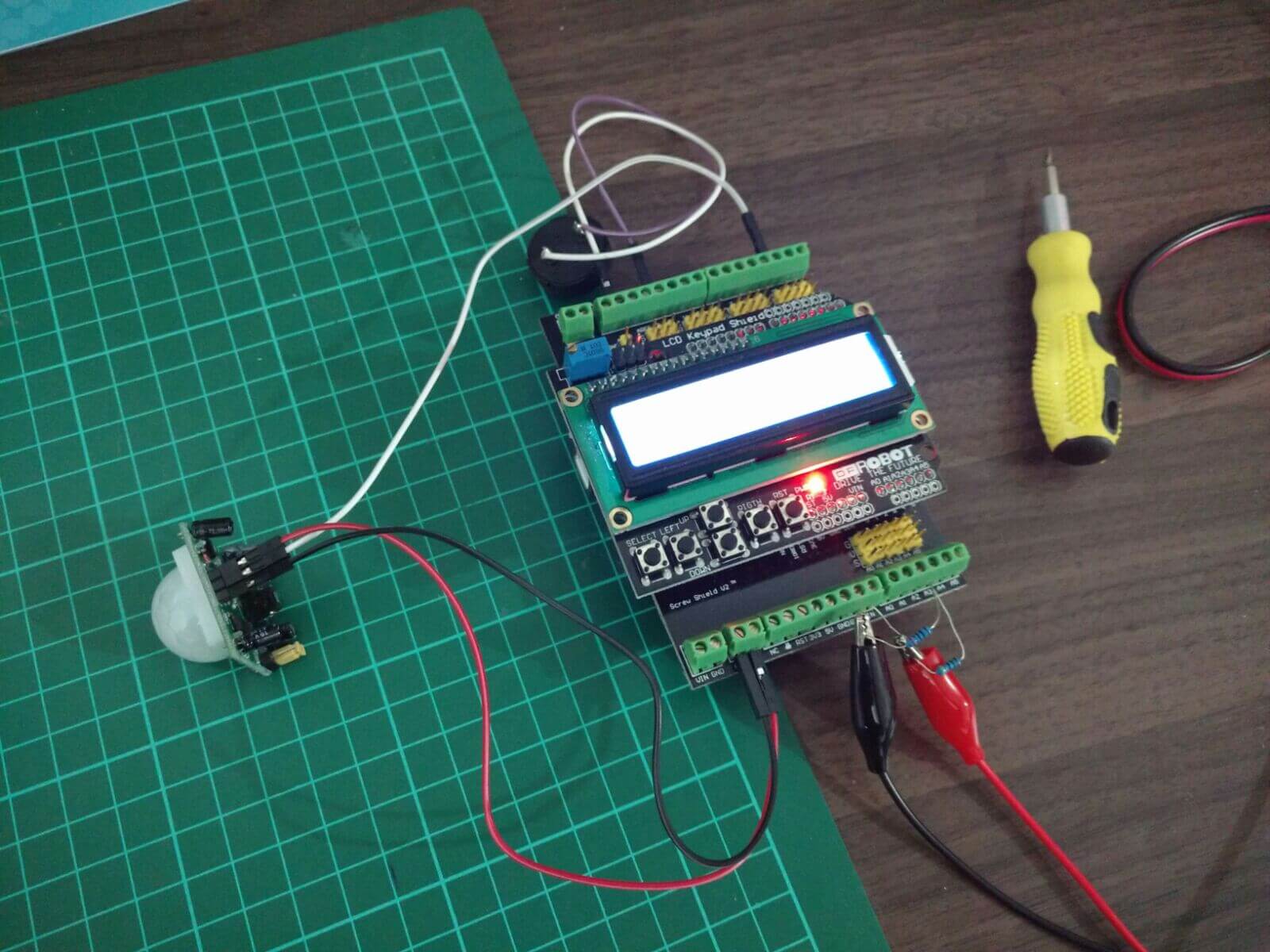 The PIR zombie detector: an Arduino with screw and LCD keypad shields, wired to a PIR motion sensor