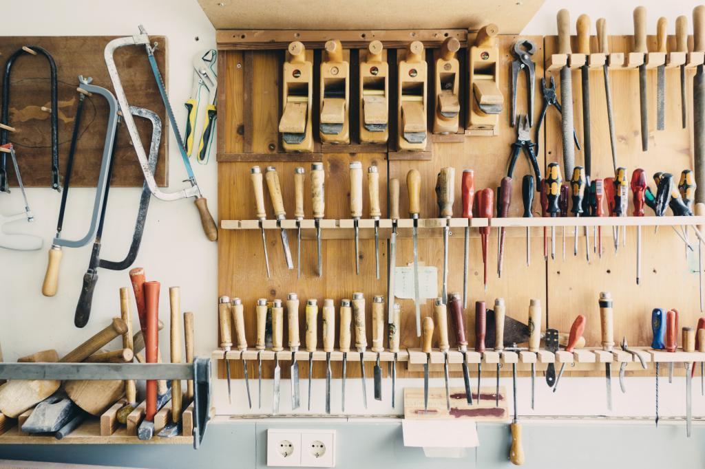 Hand tools hung neatly on a workshop wall